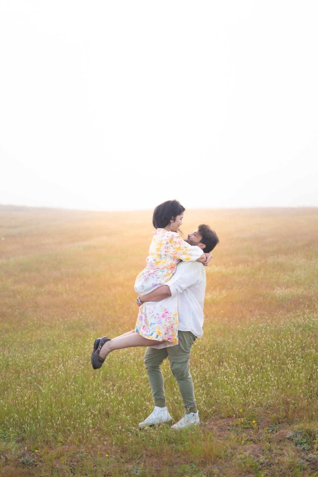 Couple Embrace in Meadow